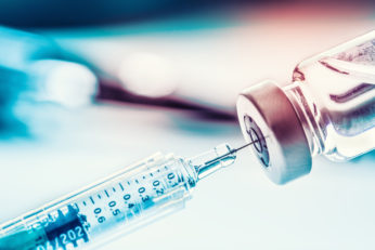 Close-up medical syringe with a vaccine.