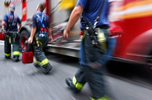 fire trucks and firefighters brigade in the city